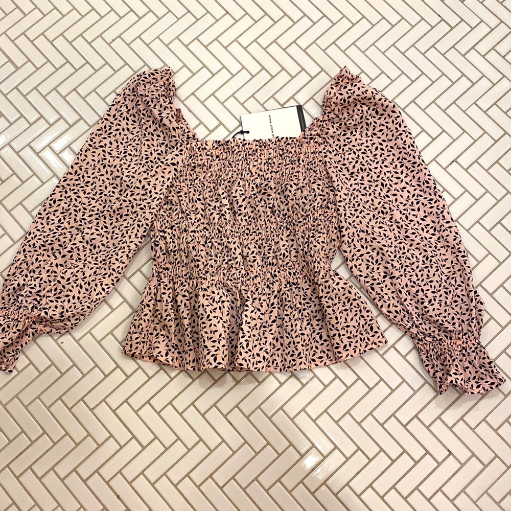Pink and black puffy long sleeve shirt